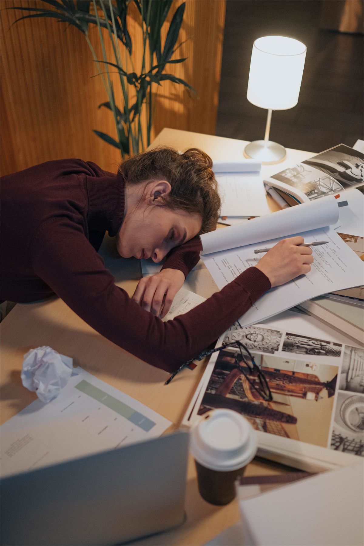 A tired person experiencing an afternoon desk slump